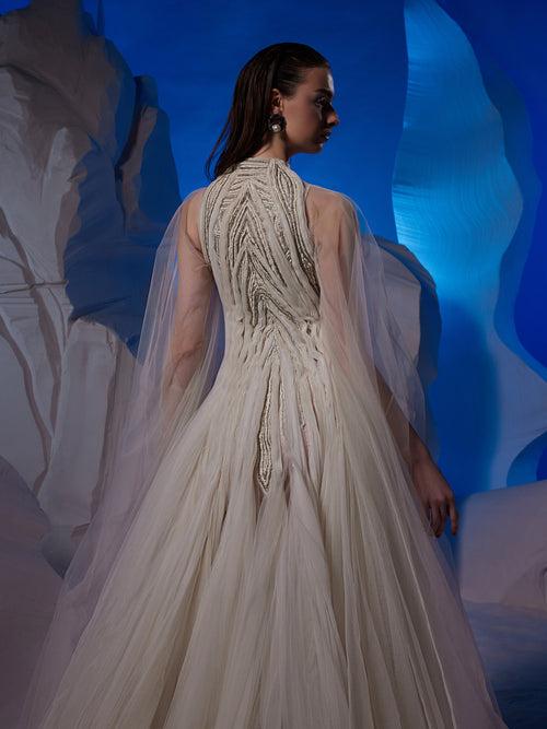 Ivory gown featuring pleating textured details.