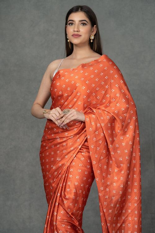 Orange Satin saree with printed florals