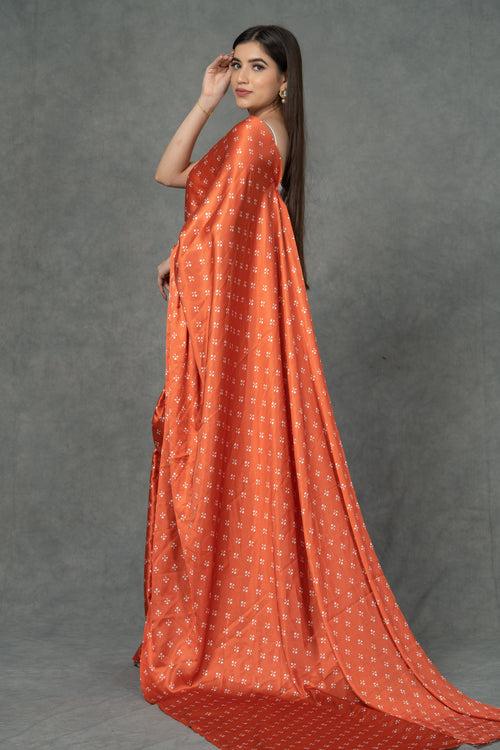 Orange Satin saree with printed florals