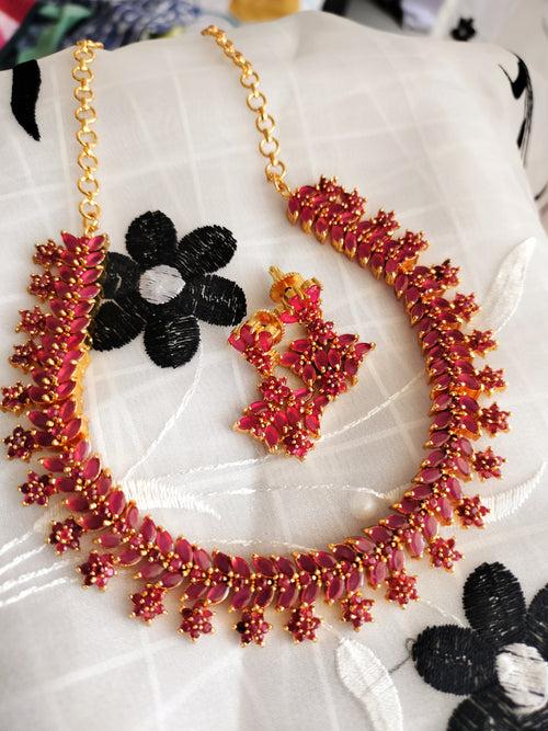 N01172_Grand Lovely designer Gold polished choker Necklace Set  embellished with American diamond stones with delicate Ruby Stones and flower work.