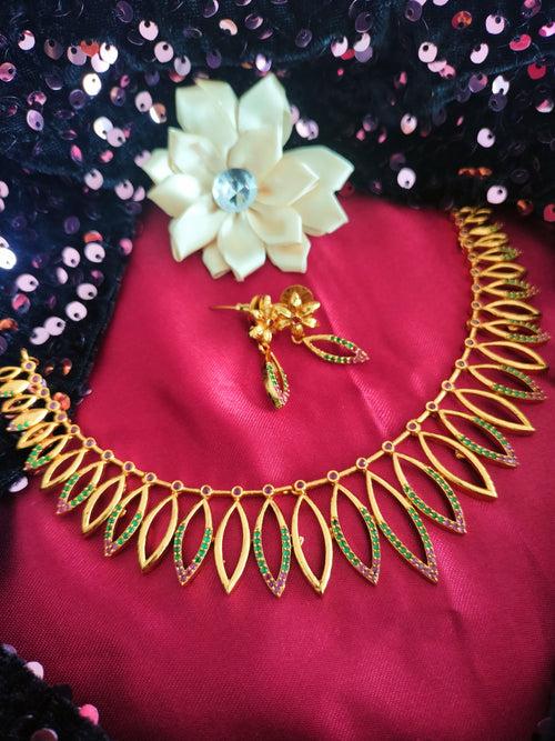 N0564_1_Classic matte gold polished temple jewelry style crafted design gold plated necklace set embellished with ruby and green stones .