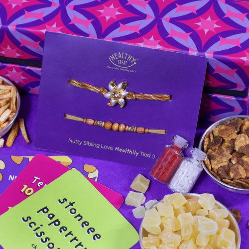 Healthy Rakhi Delights Rakhi Gift Hamper | Pack of 4 snacks, 1 Pair Rakhi, 1 Roli chawal, 4 Stickers