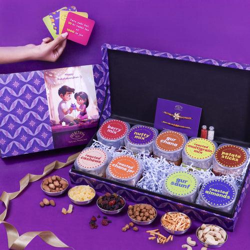 Wholesome Rakhi Gift Hamper | Pack of 9 snacks, 1 Pair Rakhi, 1 Roli chawal, 4 Stickers