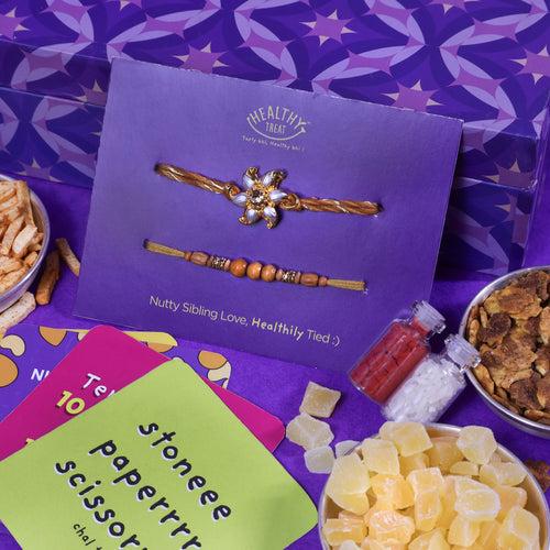 Wholesome Rakhi Gift Hamper | Pack of 9 snacks, 1 Pair Rakhi, 1 Roli chawal, 4 Stickers