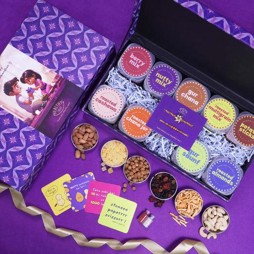 Wholesome Rakhi Gift Hamper | Pack of 9 snacks, 1 Pair Rakhi, 1 Roli chawal, 4 Stickers