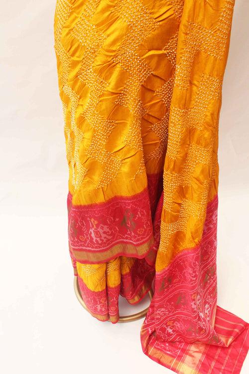 Haldi Yellow and Red Patola Border Saree with Bandhani