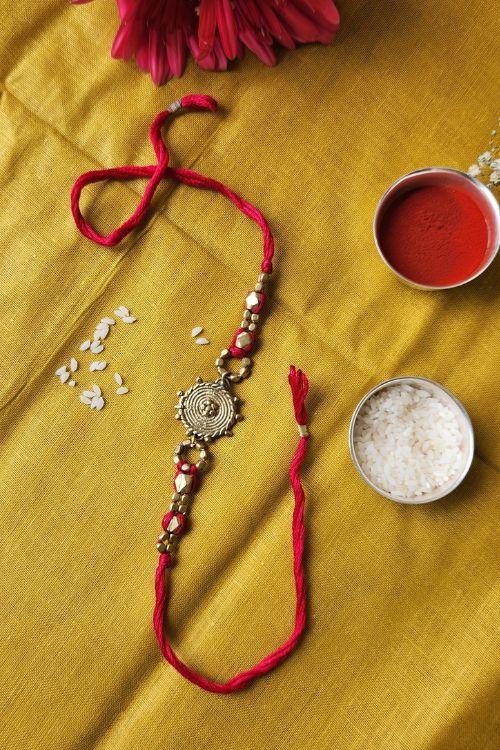 Miharu Handmade Dokra Golden Beadrd Red Thread Rakhi