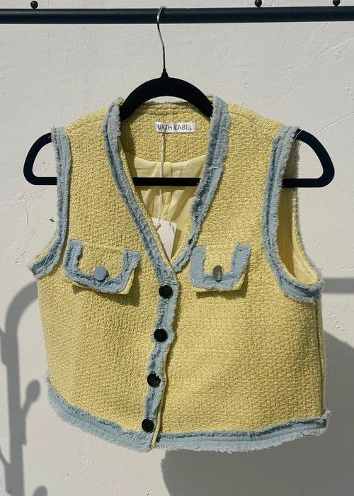 Yellow sleeveless jacket with denim