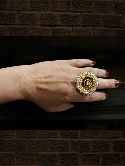 Antique gold finish adjustable ring with beaded lace on edge and stone in the middle