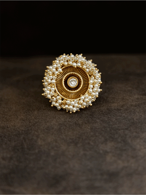 Antique gold finish adjustable ring with beaded lace on edge and stone in the middle