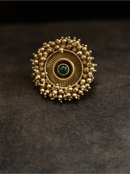 Antique gold finish adjustable ring with beaded lace on edge and stone in the middle