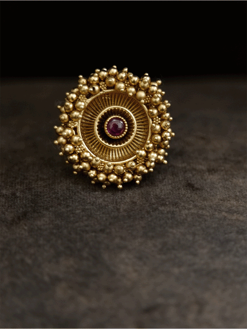 Antique gold finish adjustable ring with beaded lace on edge and stone in the middle