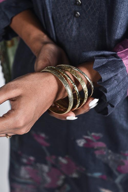 Assorted gold brass bangles