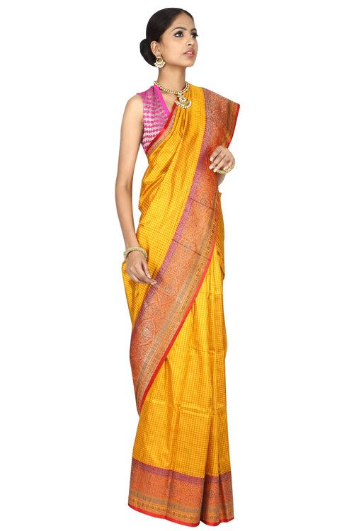 Yellow golden weave saree.