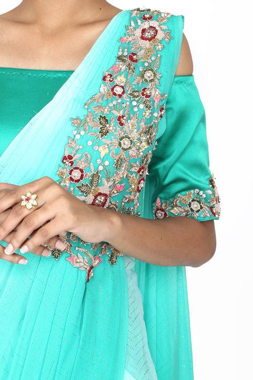 Turquoise blue ombre off-shoulder drape saree