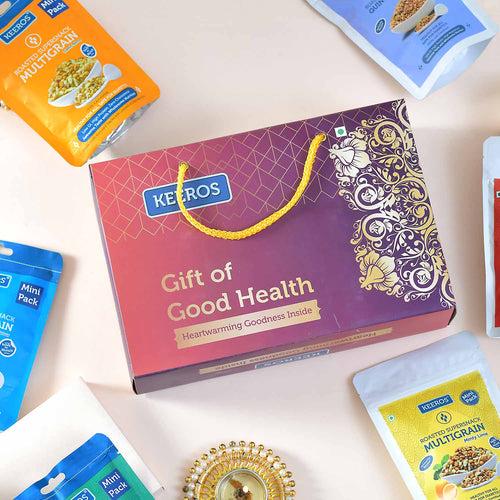 Keeros Healthy Bhai Dooj Gift Hamper with Roli Chandan Tikka Chawal Mishri Pack : Combo of Sweet & Salted, Tasty & Nutritious Snacks in a Classy Premium Gift Box | 6 Varieties of Healthy Snack Pouches of 33g to 50g