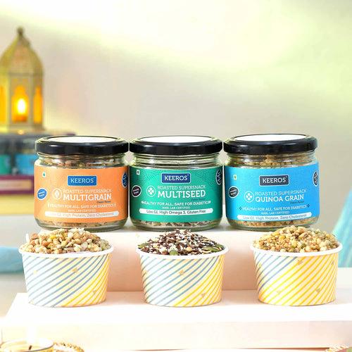 Keeros Healthy Bhai Dooj Gift for Brother with Roli Moli Chandan Tikka Chawal Mishri Pack & 2 Beautiful Diyas | Combo of Sweet & Salted, Tasty & Nutritious Super Snacks in Elegant Glass Jars Packed in Premium Gift Hamper