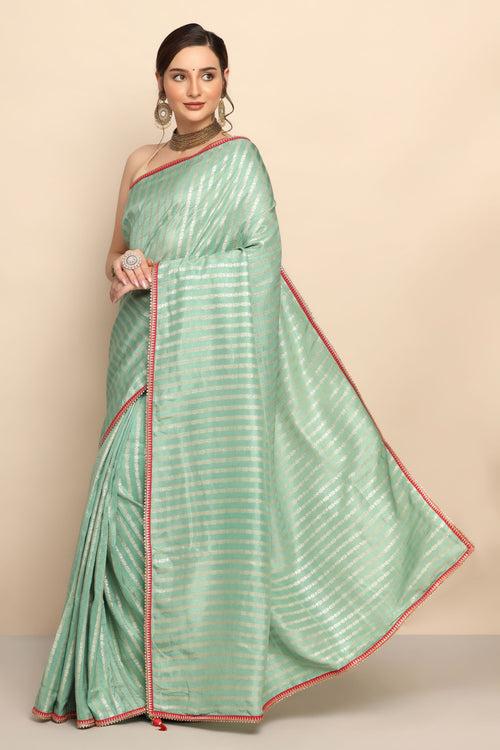 Graceful Green Silk Saree with Intricate Zari Work"