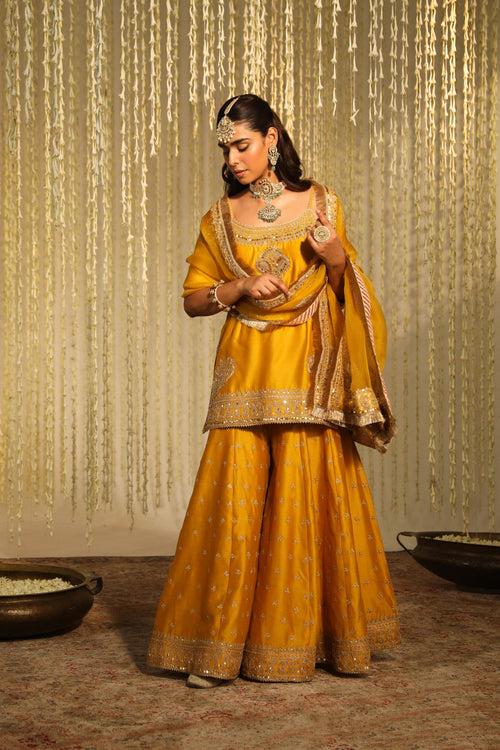 Medha Das In AABROO - GLAZE MUSTARD SHORT KURTA WITH SHARARA AND DUPATTA