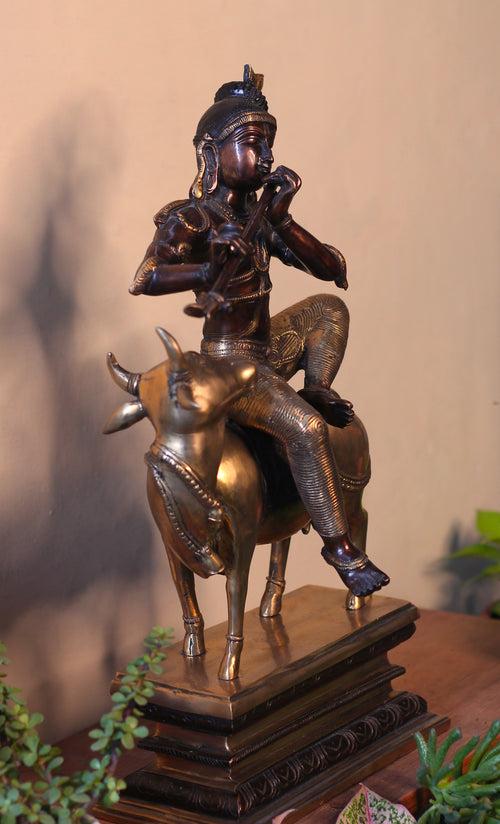 Brass Krishna Sitting On Cow 21”