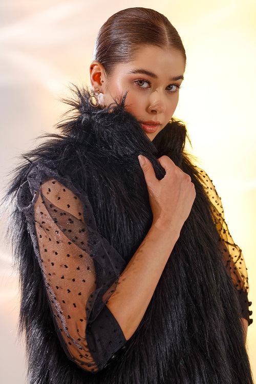 Black sleeveless fur jacket