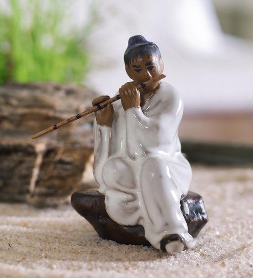 Man in white with flute bonsai miniature figurine