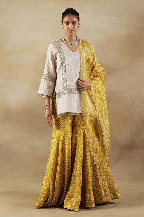 Silver Tissue Short Kurta with Mustard Bandhani Garara and Gold Self Weave Zari Dupatta