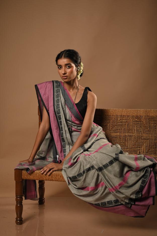 Anamika I Grey handloom cotton saree with woven elephant border