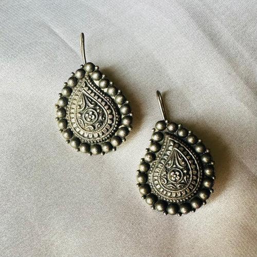 VEENA. The paisley  temple earrings.