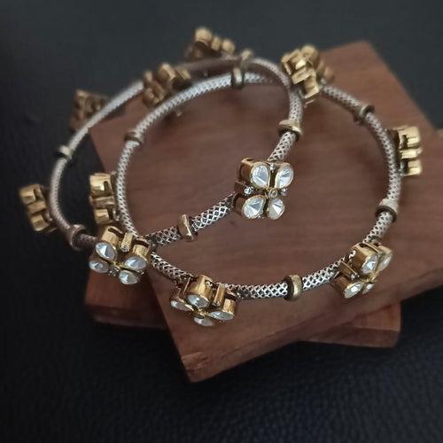 BAHAARA . Stunning Moissanite bangles in a floral design.