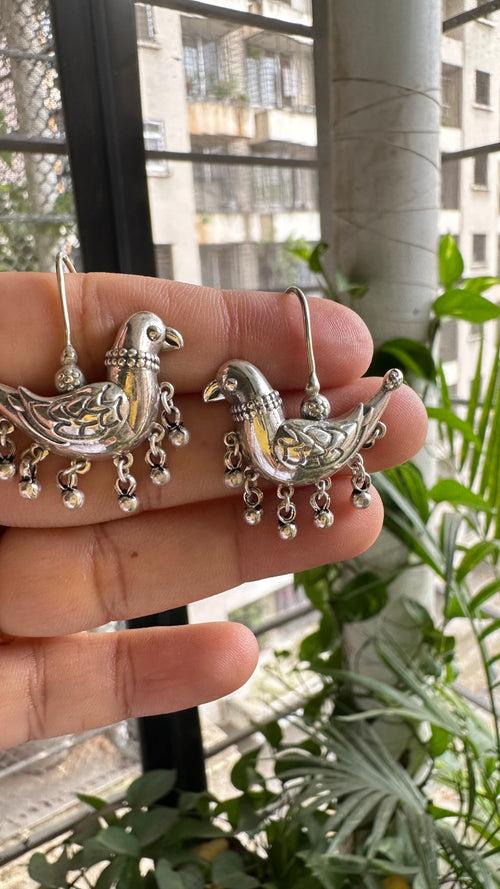 JHIMLI . Quirky parrot danglers in pure silver