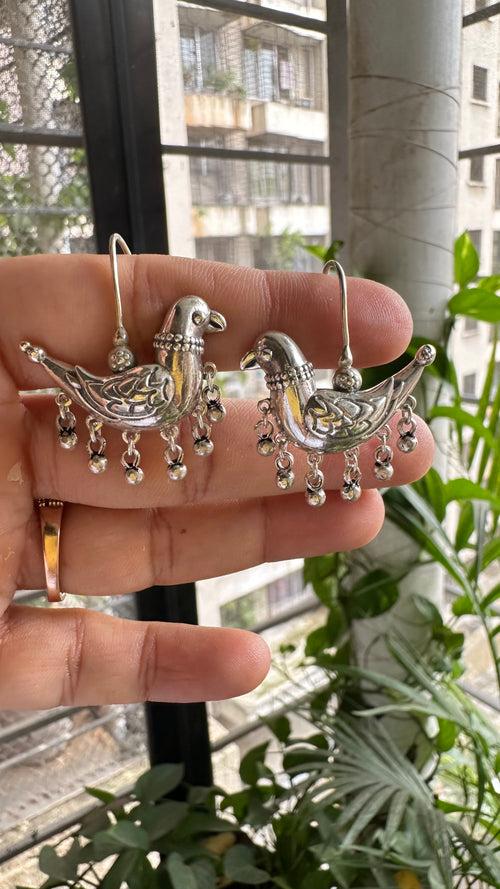 JHIMLI . Quirky parrot danglers in pure silver