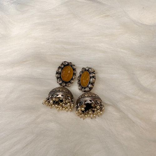 GULSHAN. Pretty stone studded jhumkas in silver .