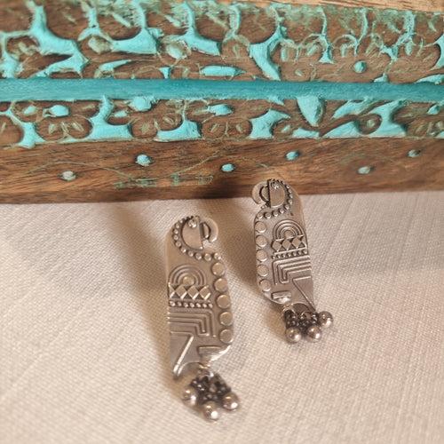 TOTA. The quirky , carved parrot earrings.