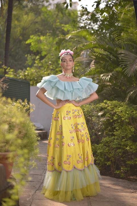 Yellow handwork  ruffle lehenga with pastel blue ruffle blouse