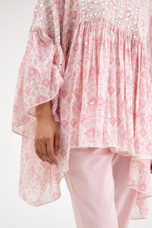 Ikat design pink and off white hand block printed cotton easy fit top with flared sleeves and hem, paired with hand-block printed striped Cotton comfortable fit pant with all-over elasticated waisband.