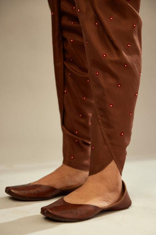 Brown silk dhoti with all over small flower embroidery.