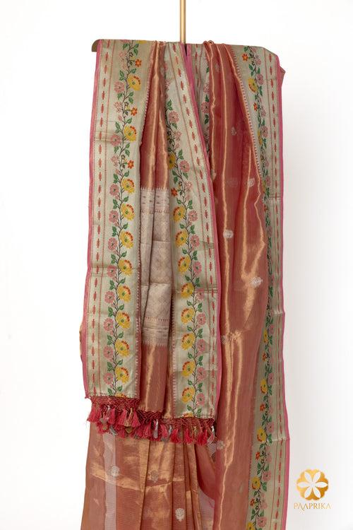 Contemporary Coral Pink Handwoven Tissue Saree with Multicolor Floral Border Accents