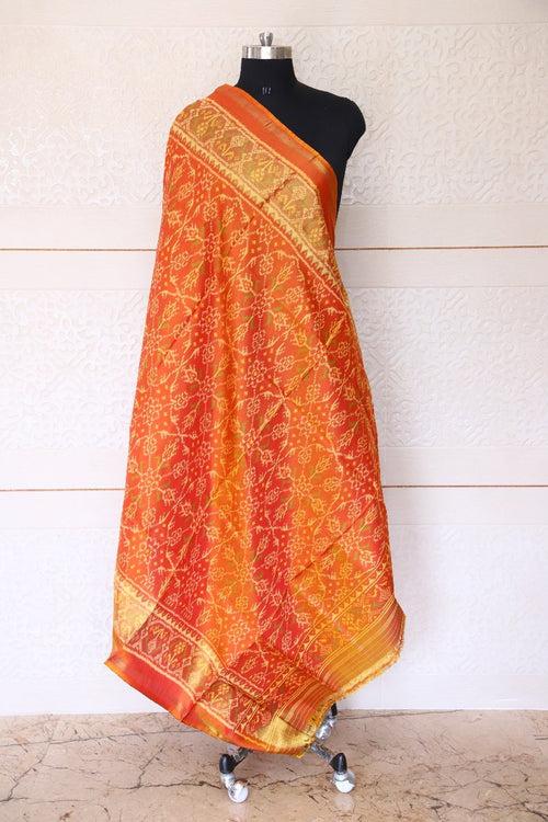 Traditional Chhabadi bhat design in rust yellow colour