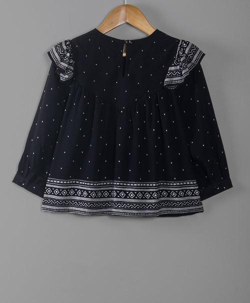 BLACK DOT PRINT TOP WITH BORDER AT THE BOTTOM EDGE