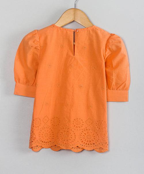 ORANGE TOP WITH EYELET EMBROIDERY AT THE BOTTOM
