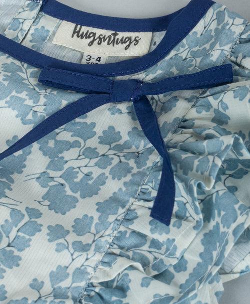 SOFT BLUE ALL OVER LEAF PRINT TOP WITH NAVY NECK BINDING AND TIE UP