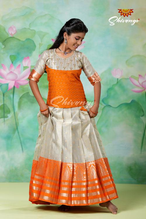 Silver Fog Girls Pattu Pavadai Designs in Orange