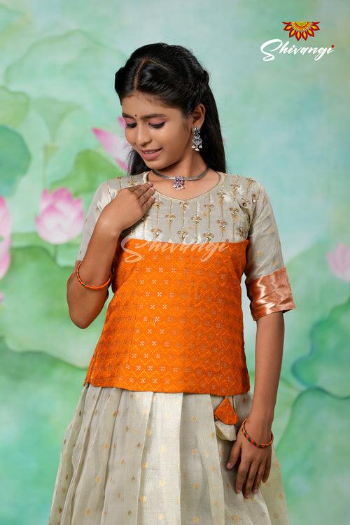 Silver Fog Girls Pattu Pavadai Designs in Orange