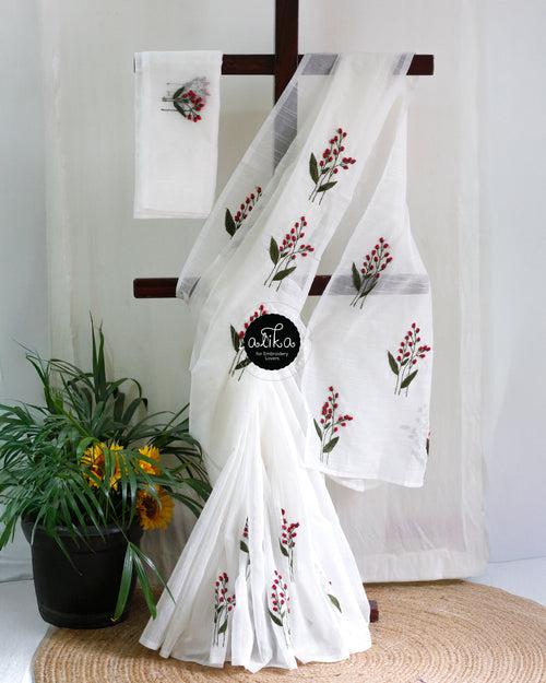 Unveil Your Festive Radiance in the Enchanting Hand Embroidered White Kota Saree