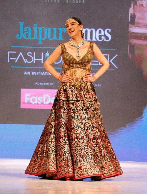 Black and Gold Lehenga with a Cut Out Fringe Blouse.