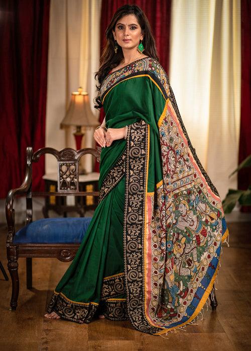 Forest green satin saree with hand painted kalamkari pallu