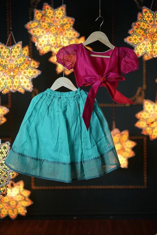 Dahlia girls ethnic wear set with teal lehenga skirt and a pink tie back choli in handwoven cotton silk