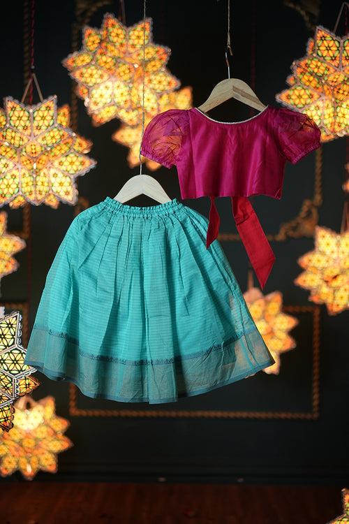 Dahlia girls ethnic wear set with teal lehenga skirt and a pink tie back choli in handwoven cotton silk