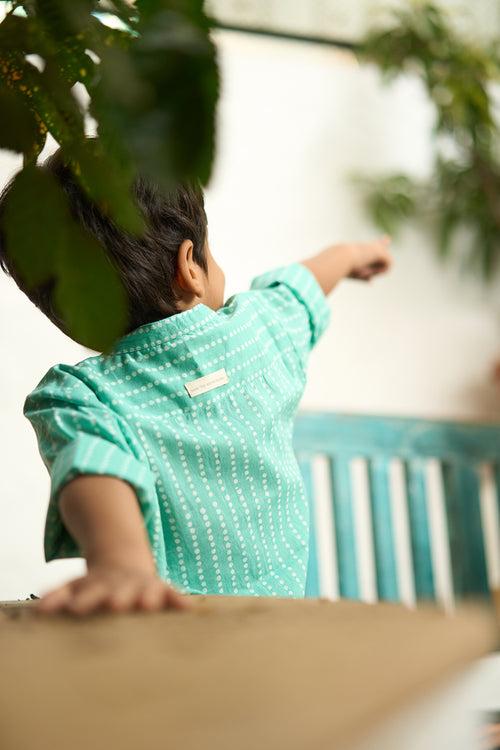 ‘Barefoot Boy’ mandarin collar hand block printed malmal cotton unisex full sleeve summer shirt in blue with white polka dots for boys and girls